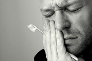 Man in pain because of his abscessed tooth