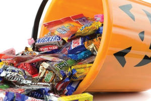 Bucket of halloween candy that can cause cavities