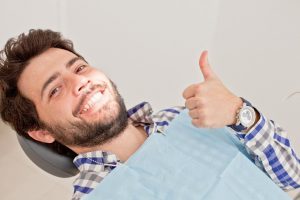 Man excited to receive restorative dental services