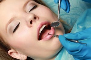 Woman about to have a root canal at Cobblestone Park Family Dental